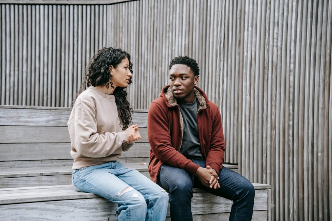 A photo showing a couple engaged in a thoughtful conversation or connection.