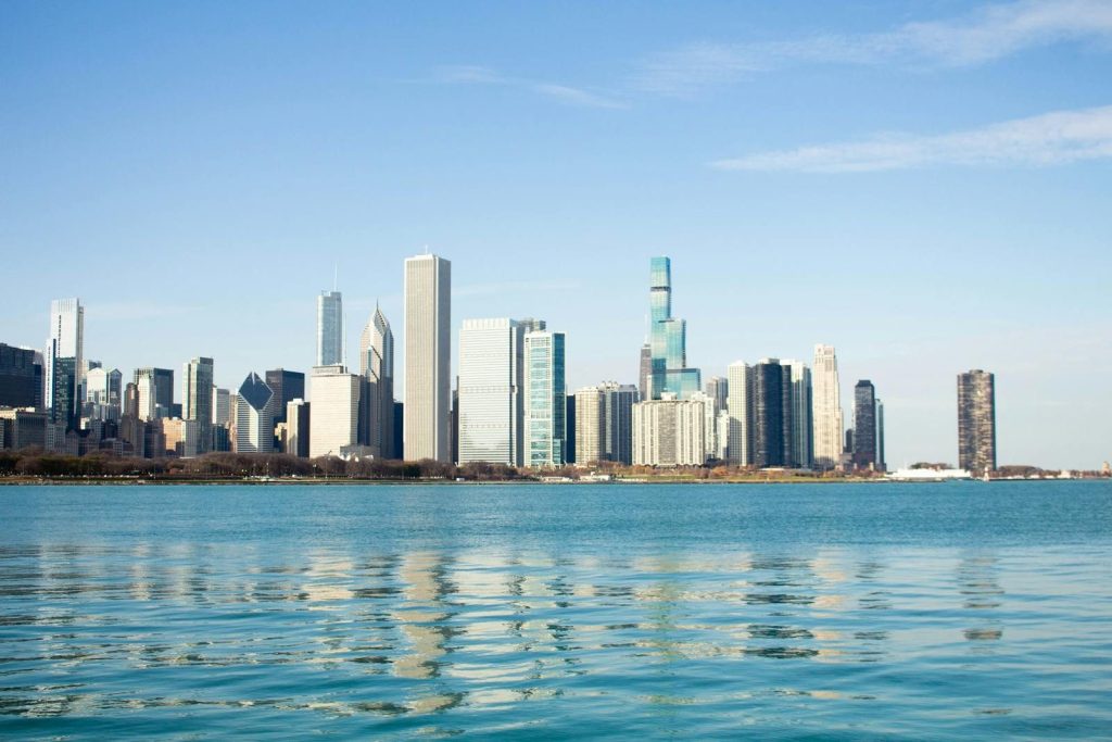 Stunning view of the Chicago skyline from Lake Michigan with clear blue skies.