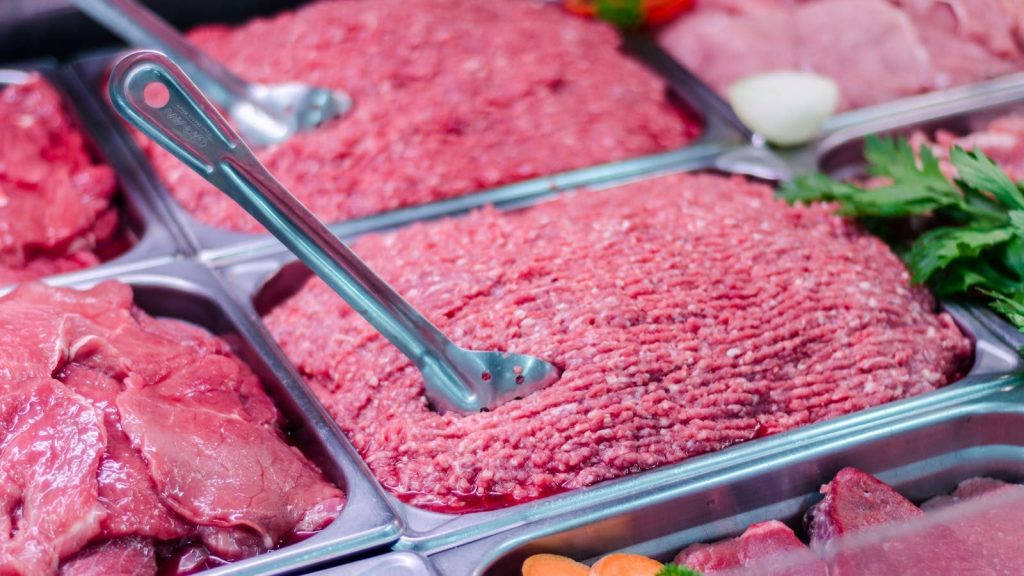 Close-up of fresh meat and minced beef in a retail display at San Vito market, Costa Rica.