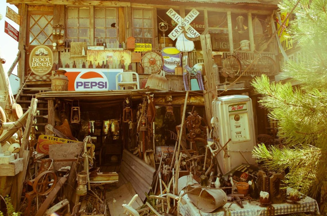 A vintage store filled with antique signs, rustic decor, and collectibles, creating a nostalgic ambiance.