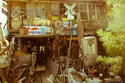 A vintage store filled with antique signs, rustic decor, and collectibles, creating a nostalgic ambiance.