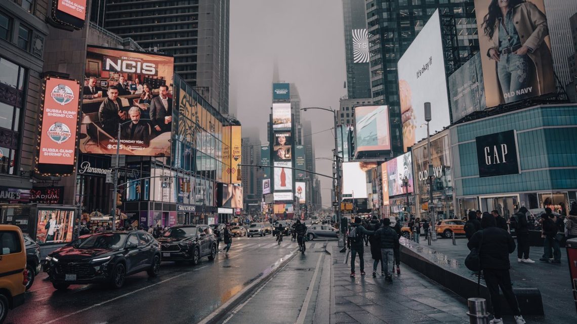 Rainy day in Times Square capturing lively urban atmosphere and vibrant billboards.