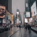 Rainy day in Times Square capturing lively urban atmosphere and vibrant billboards.