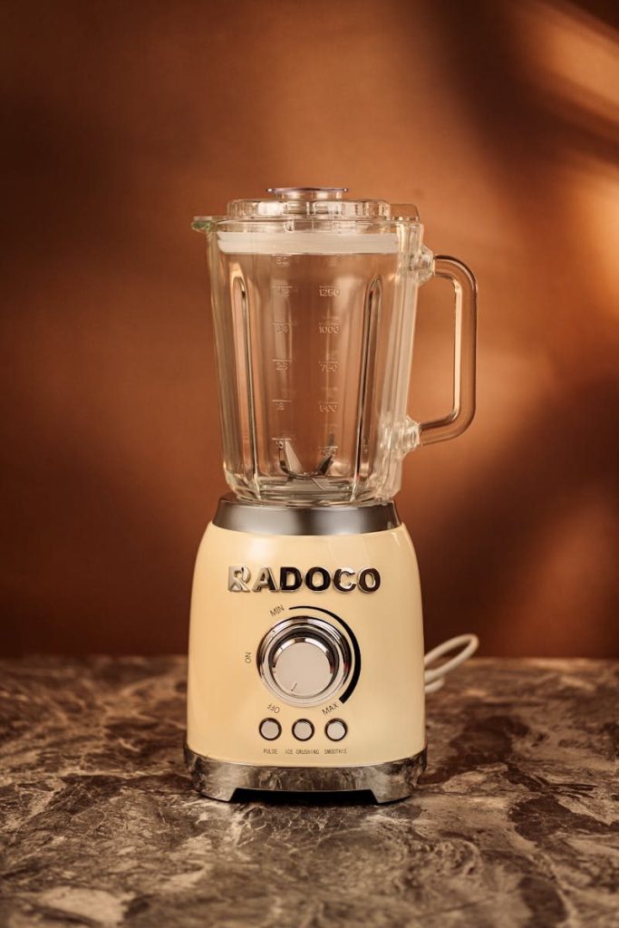 Retro style blender with glass jar on marble counter