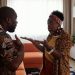 A couple arguing passionately in their living room, expressing emotions and gestures.