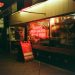 Neon sign for pizza place at night